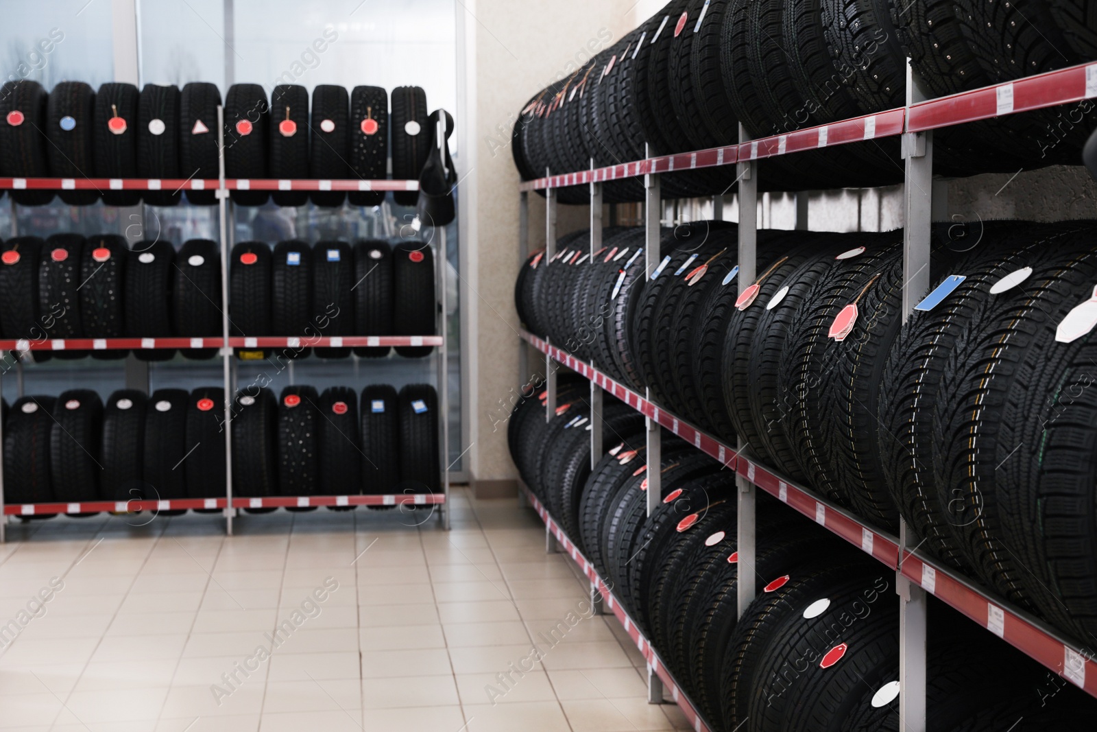 Photo of Car tires on rack in auto store