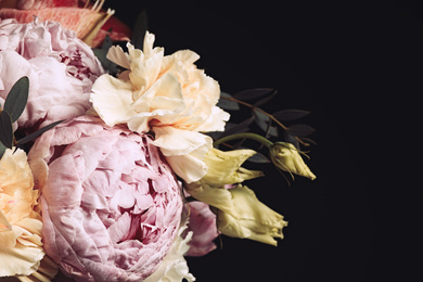 Photo of Beautiful bouquet of different flowers on black background, closeup. Floral card design with dark vintage effect