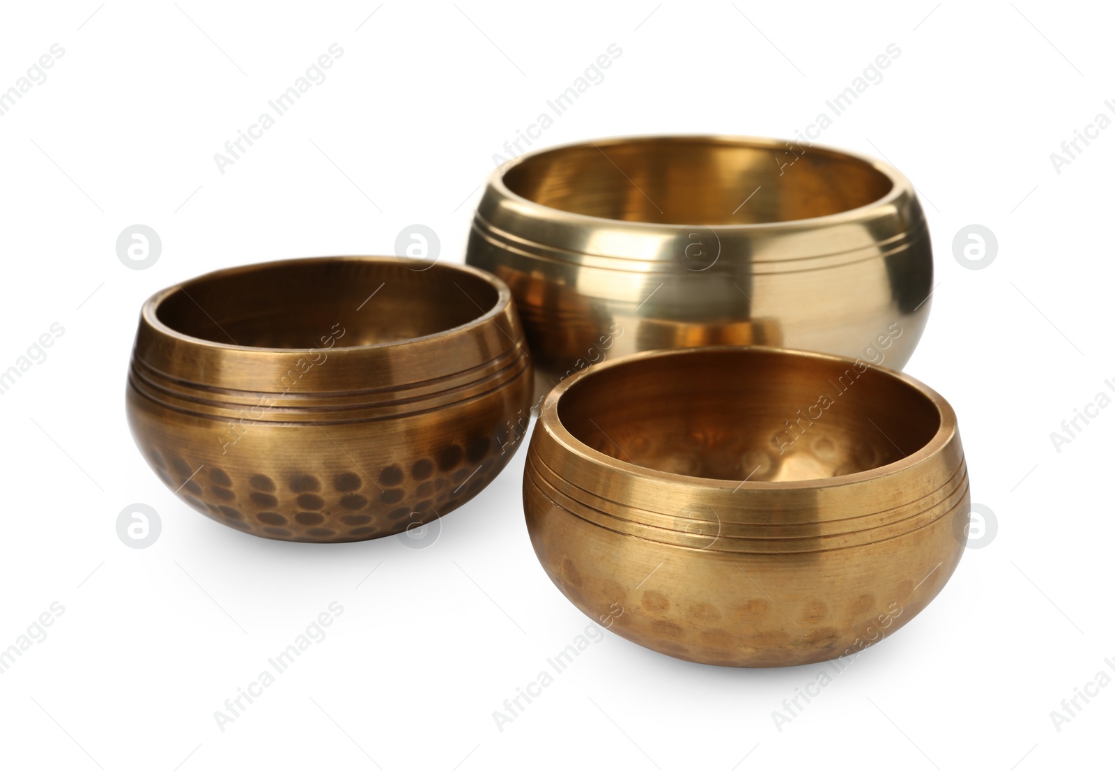 Photo of Three Tibetan singing bowls on white background