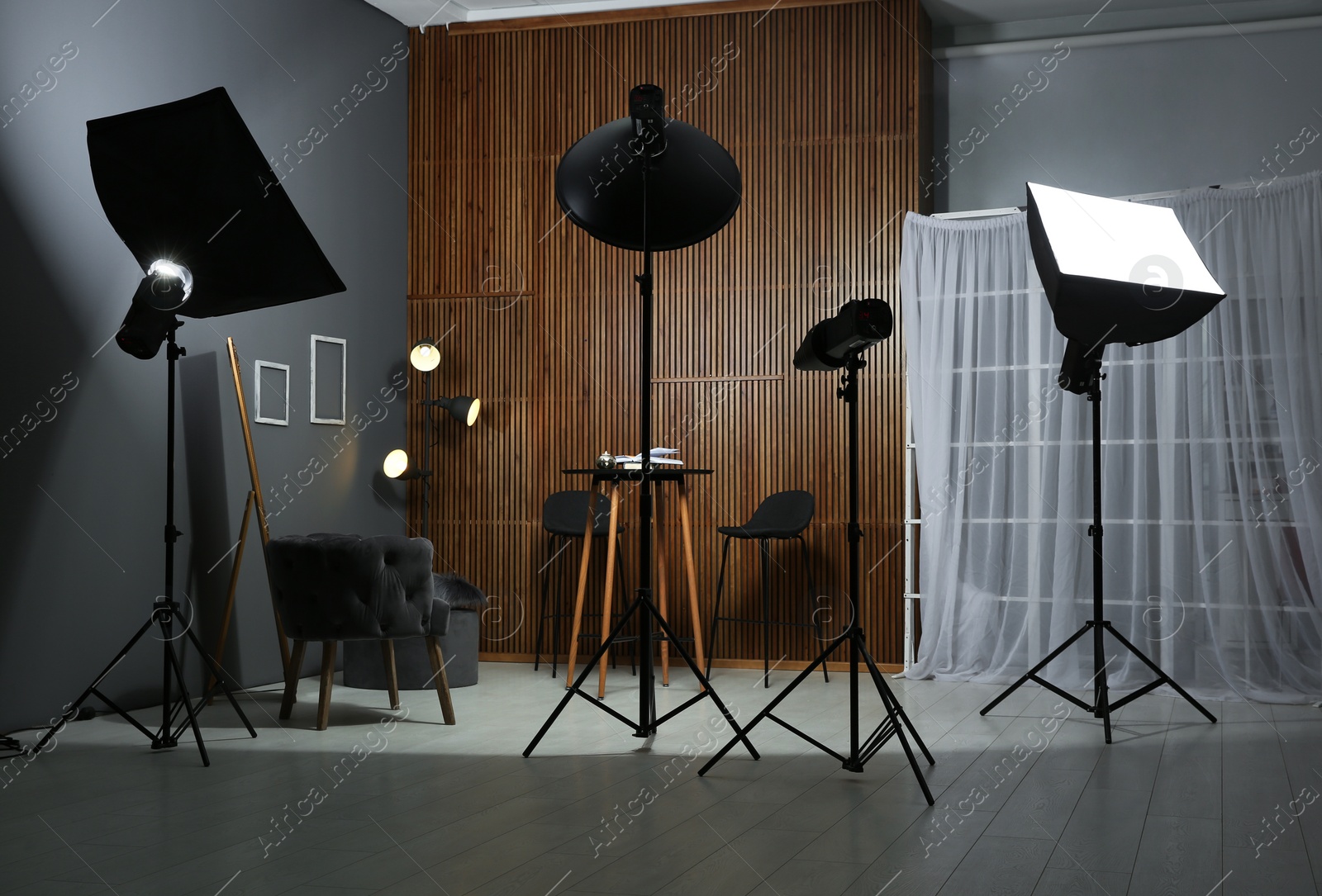 Photo of Example of living room interior design and professional equipment in photo studio