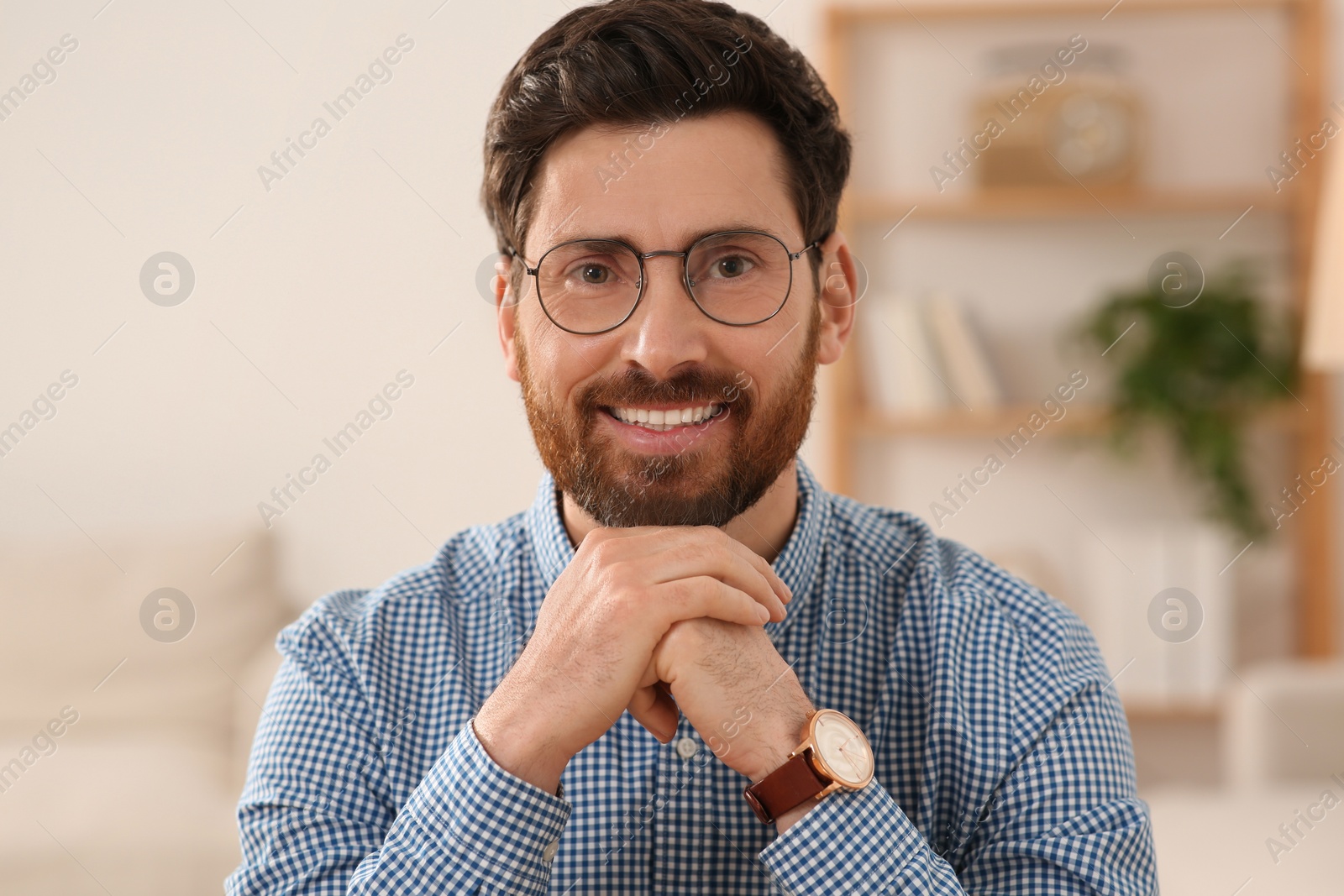 Photo of Happy man having online meeting at home, view from web camera