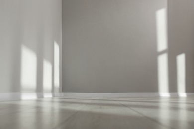 Photo of Light and shadows from window on floor and walls indoors