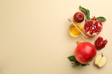 Photo of Flat lay composition with Rosh Hashanah holiday attributes on beige background. Space for text