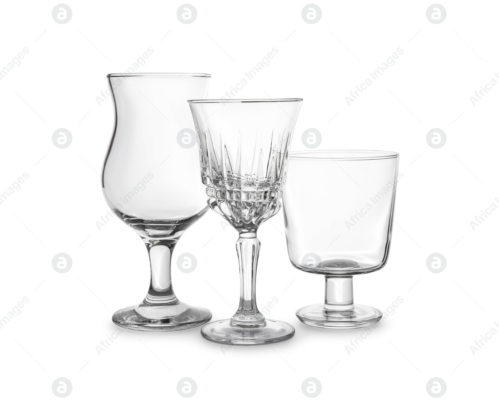 Photo of Set of different glasses on white background