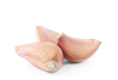 Photo of Fresh unpeeled garlic cloves on white background