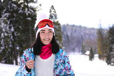 Young woman at mountain resort. Winter vacation