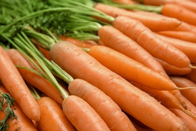 Photo of Ripe carrots as background, closeup. Healthy diet