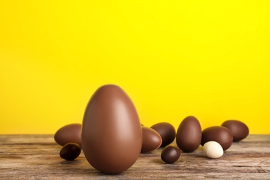 Photo of Beautiful composition with chocolate Easter eggs on wooden table