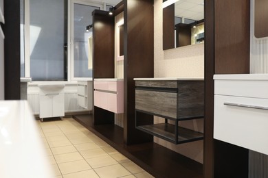 Assortment of bathroom vanity units in store