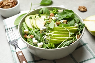 Photo of Tasty salad with pear slices on table, closeup