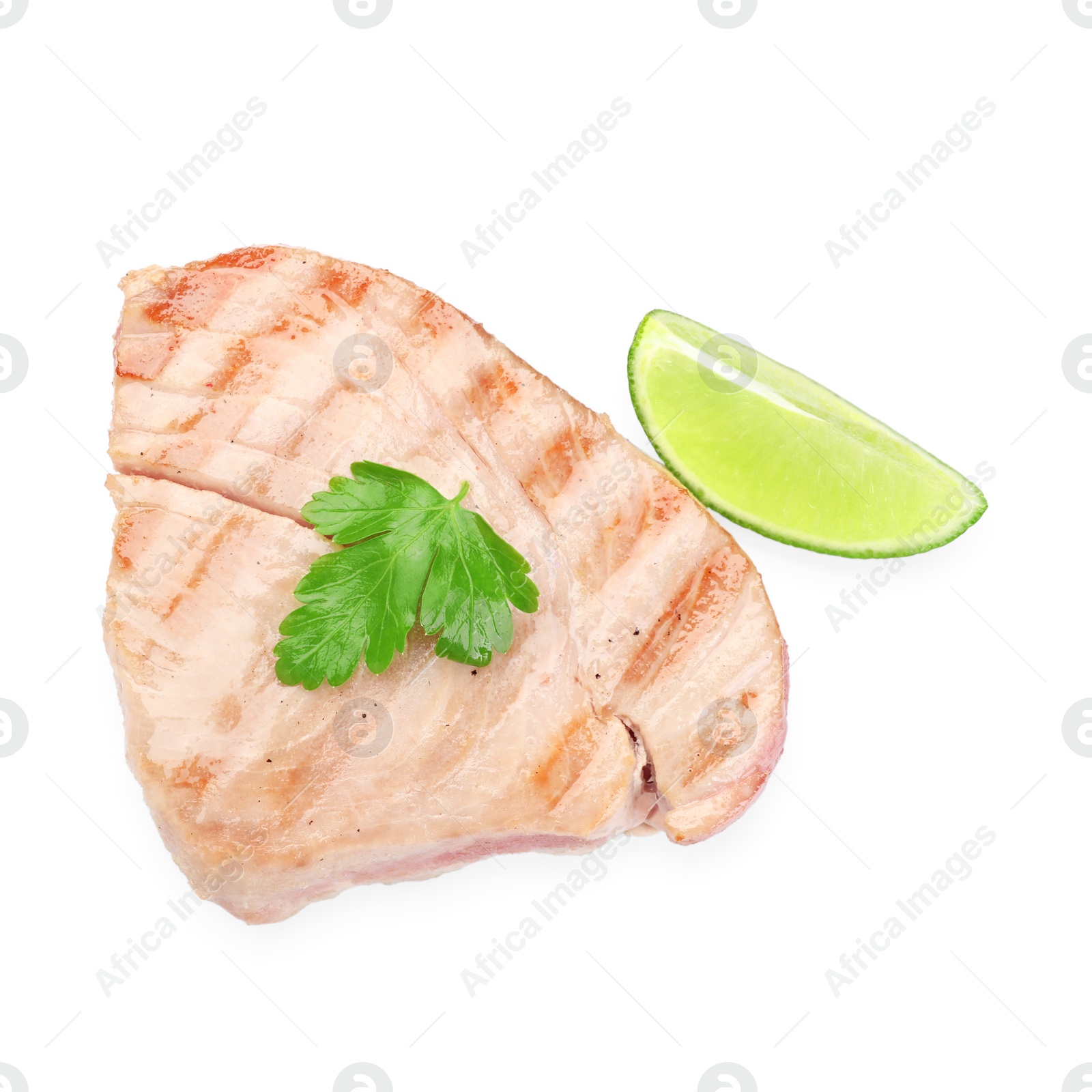 Photo of Delicious tuna steak with parsley and lime isolated on white, top view