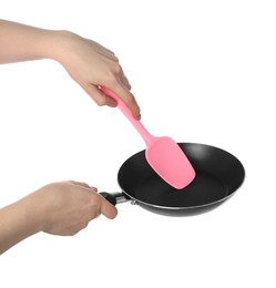 Photo of Woman with spatula and frying pan on white background, closeup