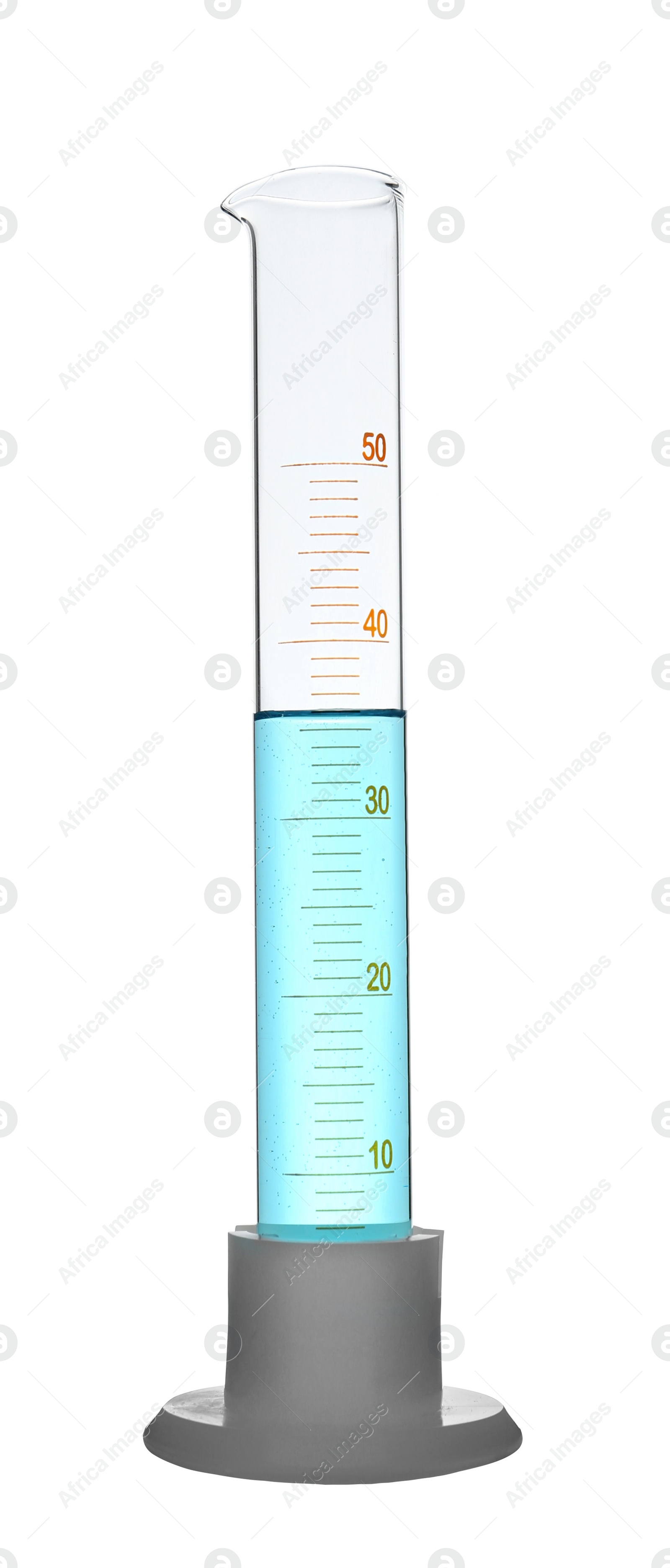 Photo of Graduated cylinder with light blue liquid isolated on white