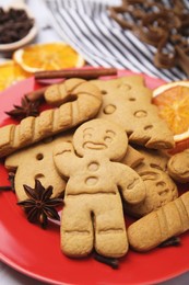 Photo of Different tasty cookies and spices on plate, closeup