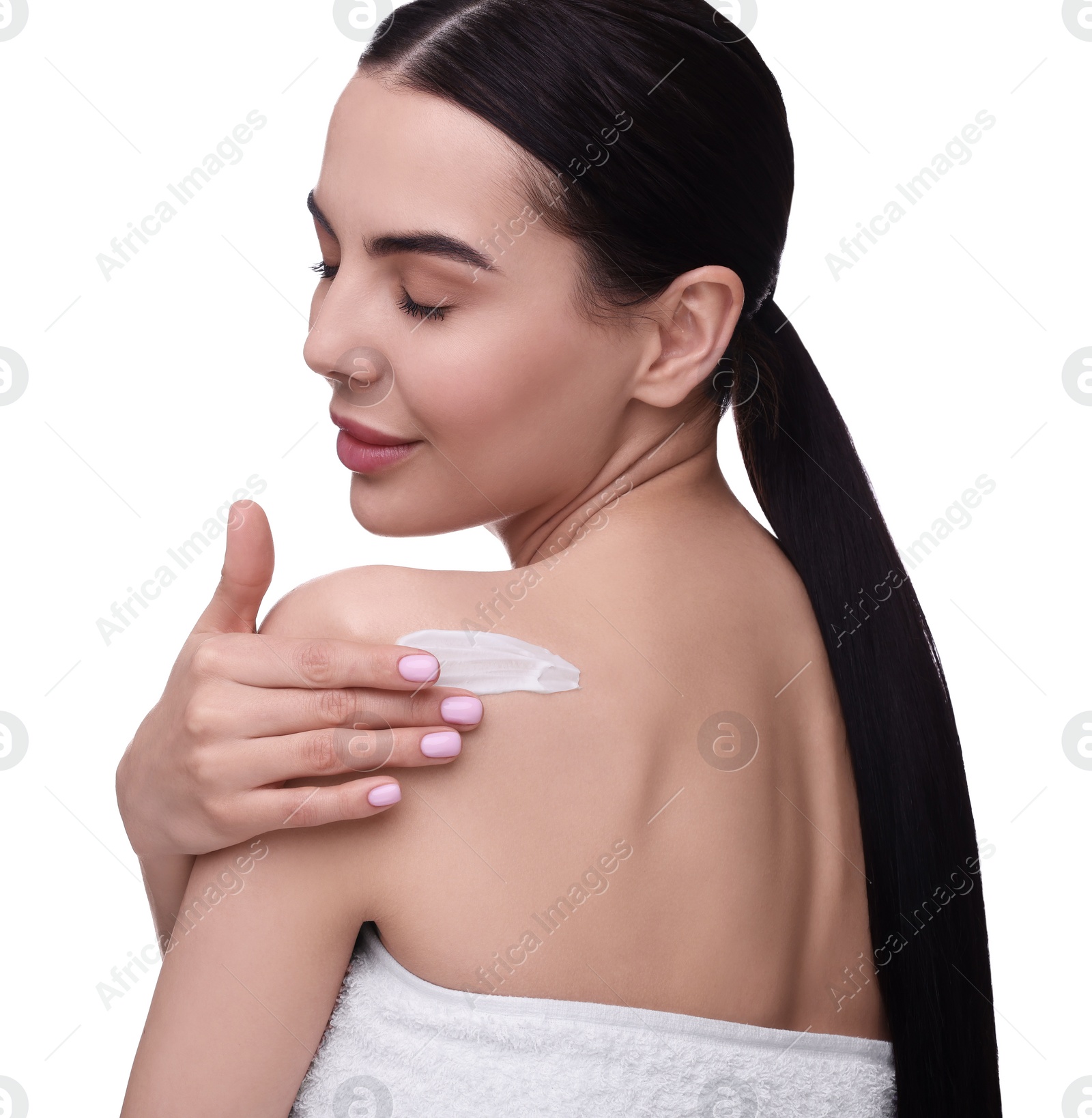 Photo of Beautiful woman with smear of body cream on her shoulder against white background