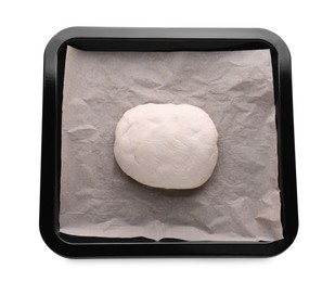 Photo of Baking pan with parchment paper and dough isolated on white, top view