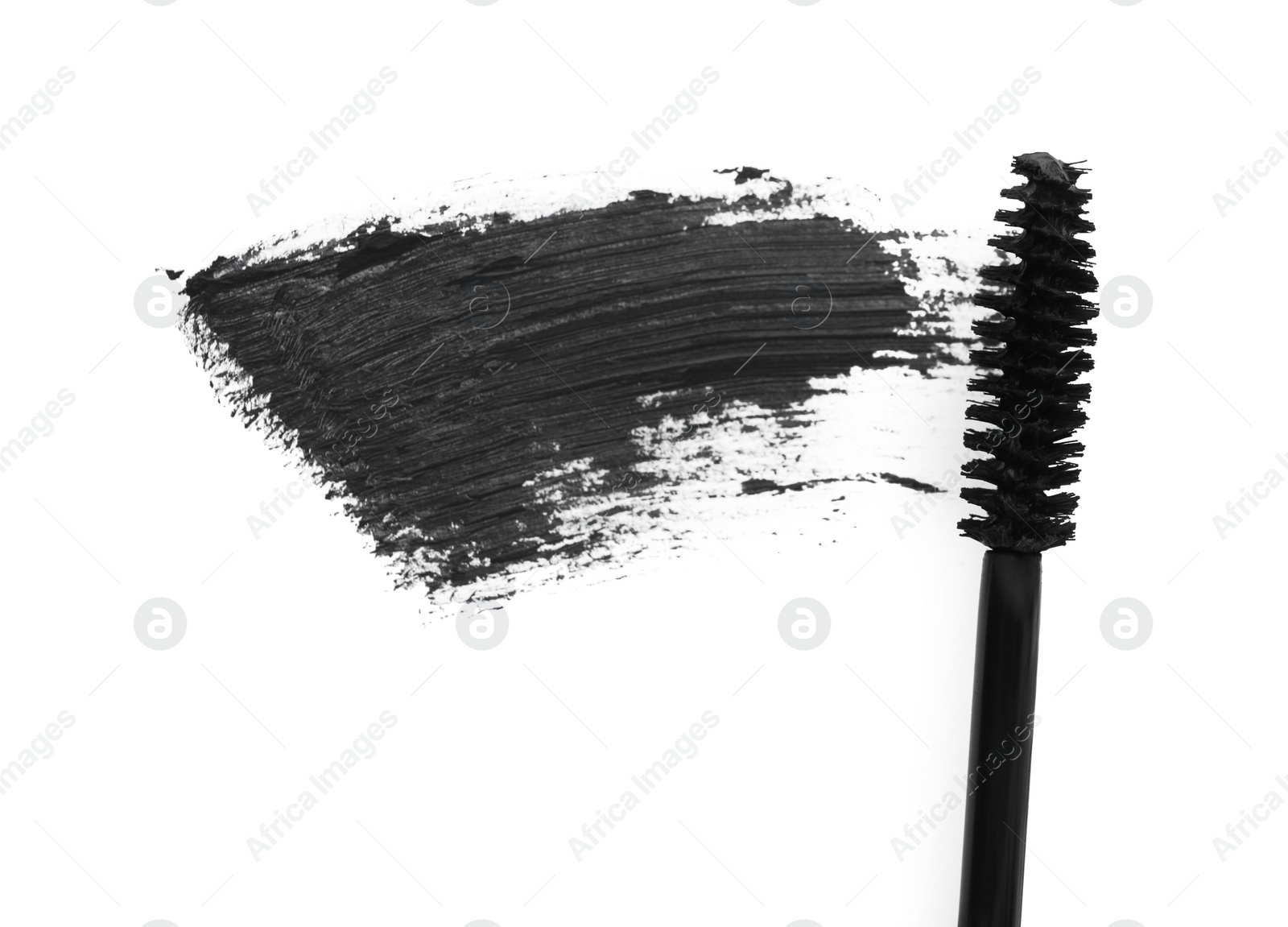 Photo of Applicator and black mascara smear on white background, top view