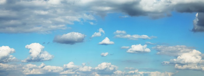 Beautiful blue sky with white fluffy clouds. Banner design