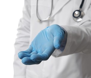 Doctor wearing light blue medical glove holding something on white background, closeup