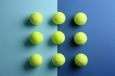 Tennis balls on color background, flat lay. Sports equipment