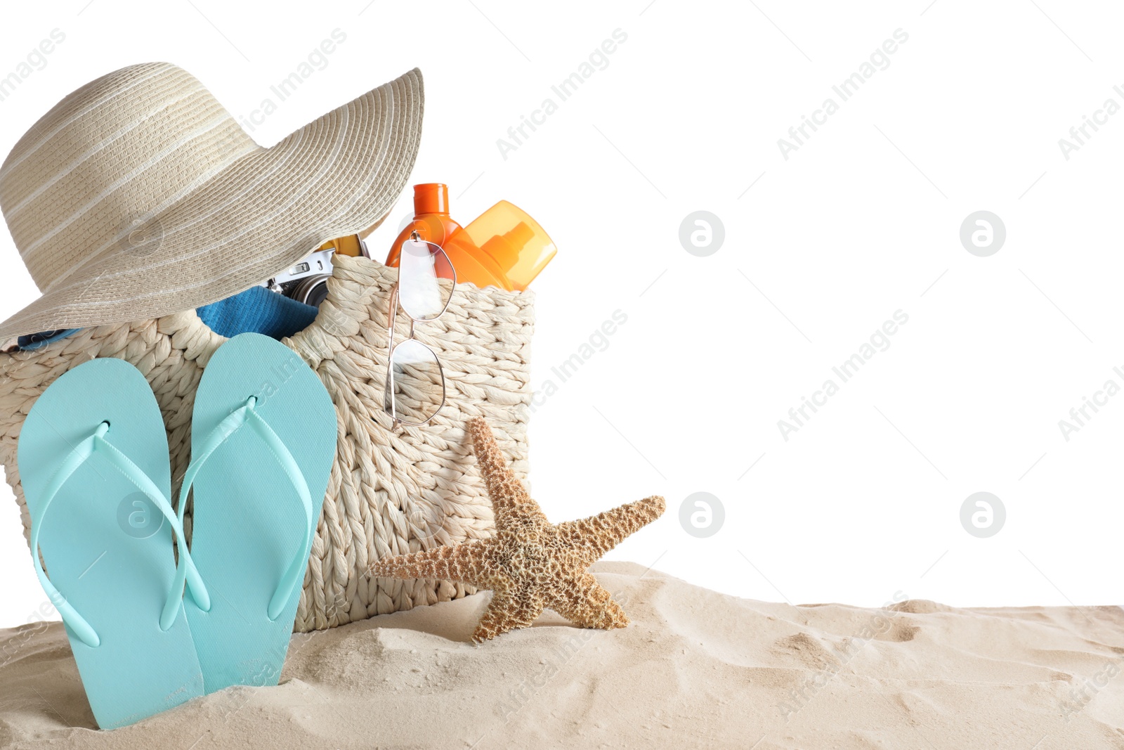 Photo of Composition with beach objects on sand against white background, space for text