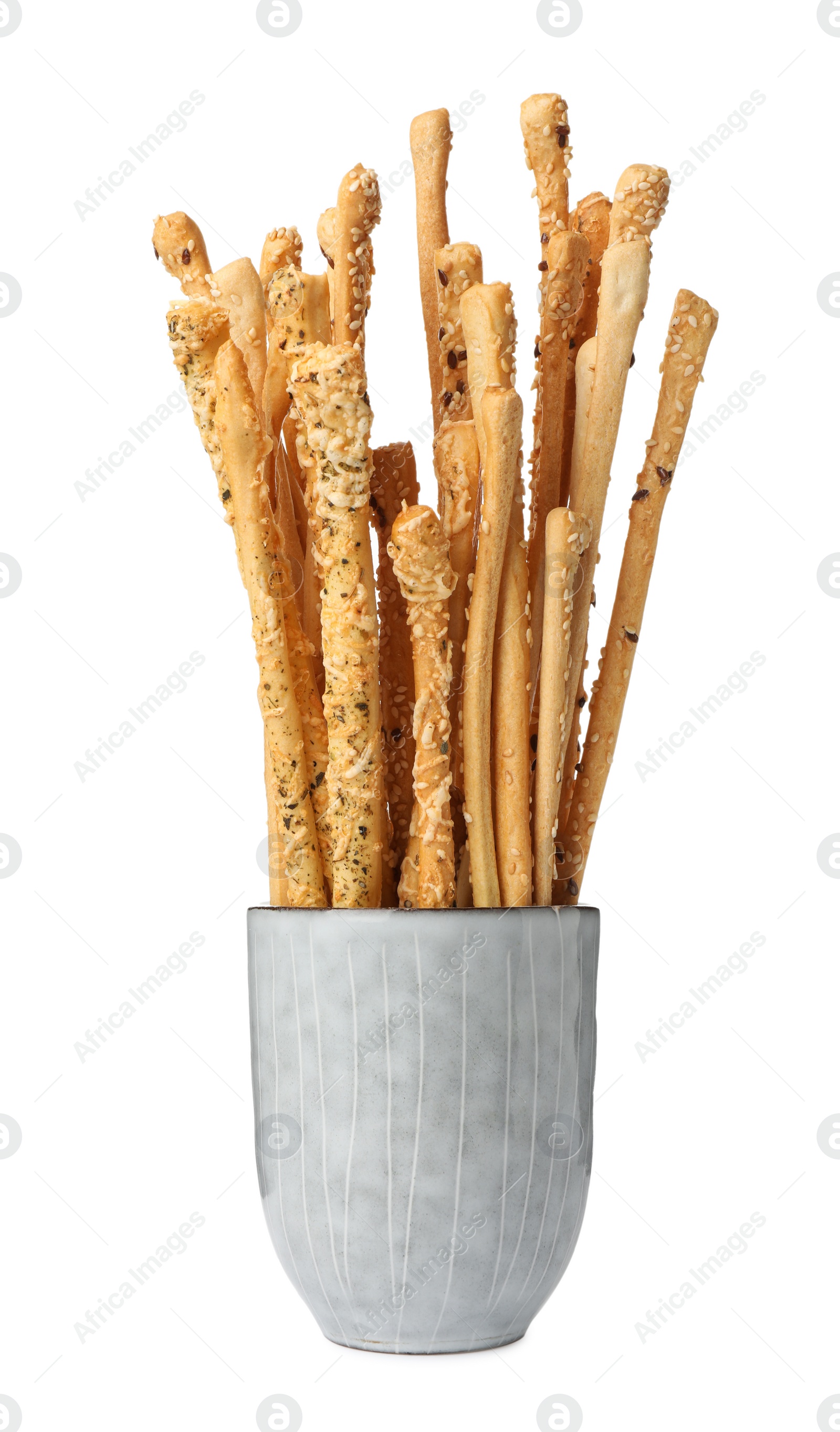 Photo of Delicious grissini sticks in cup on white background