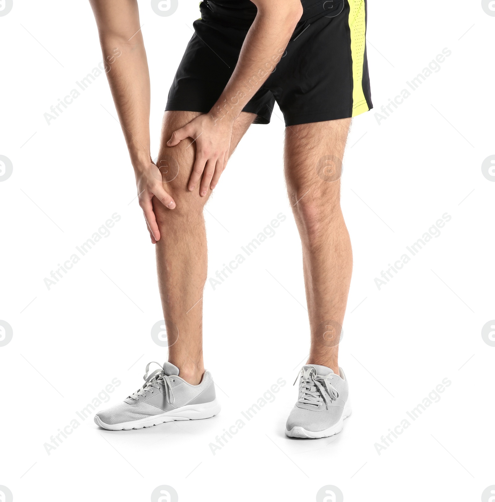 Photo of Man suffering from leg pain on white background, closeup