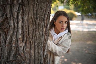 Photo of Jealous woman spying on ex boyfriend in park