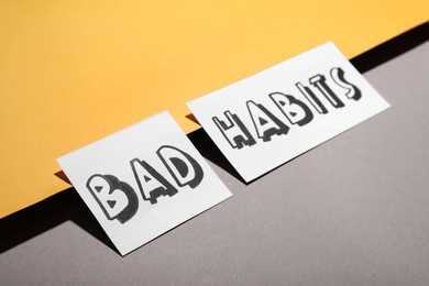 Photo of Composition with words Bad Habits on color background