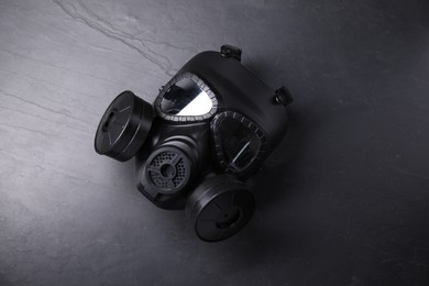 Photo of One gas mask on grey textured background, top view