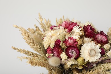 Photo of Beautiful bouquet of dry flowers on white background, closeup