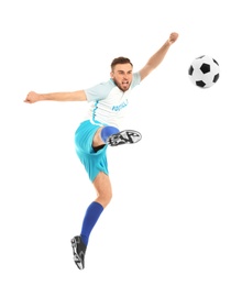 Young man playing football on white background