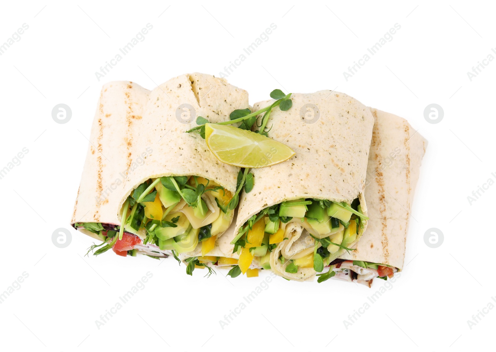 Photo of Delicious sandwich wraps with fresh vegetables and slice of lime isolated on white, top view