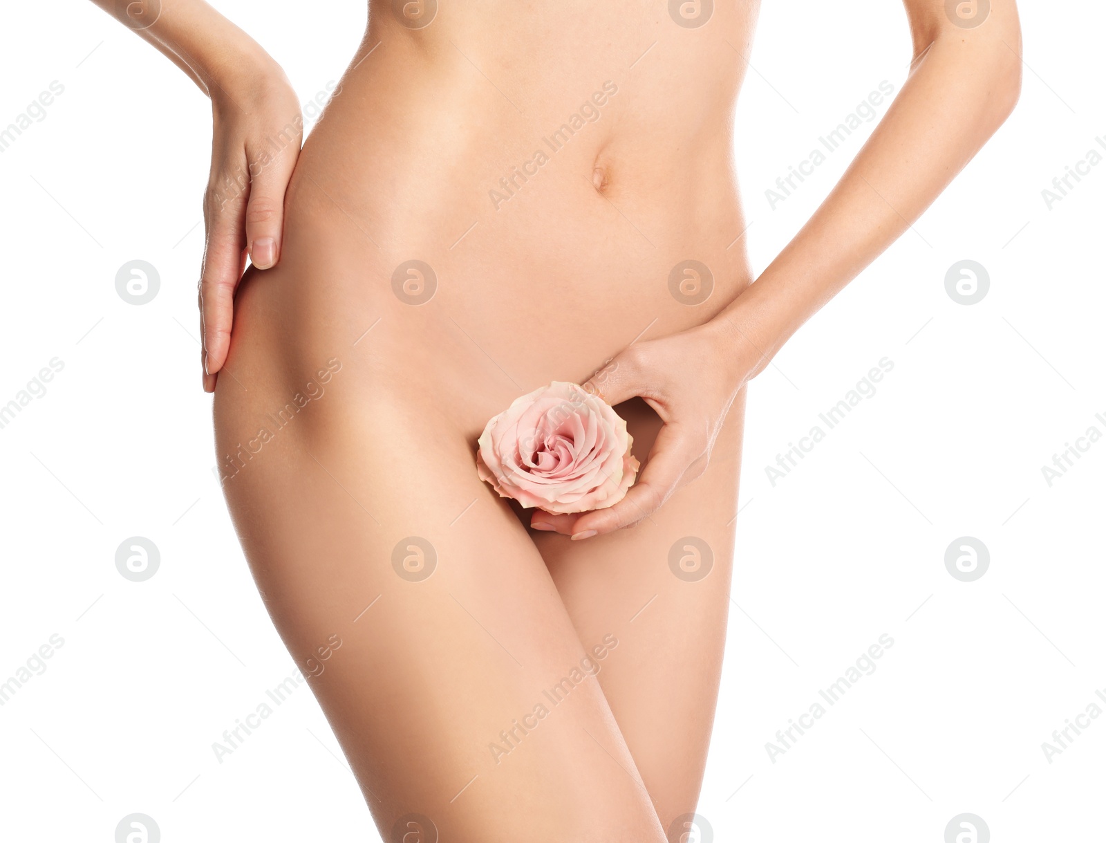 Photo of Woman with flower showing smooth skin after Brazilian bikini epilation on white background, closeup. Body care concept