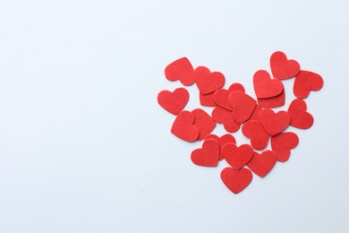 Photo of Paper hearts on white background, top view. Space for text