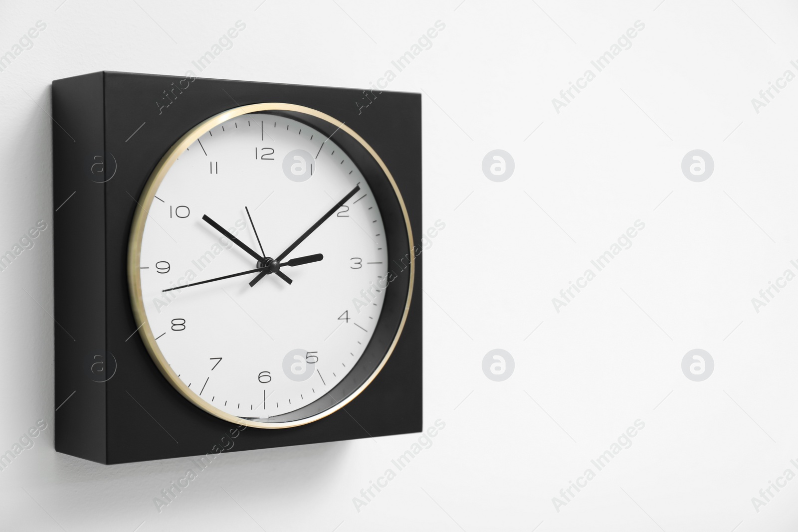 Photo of Stylish clock on white background. Time concept