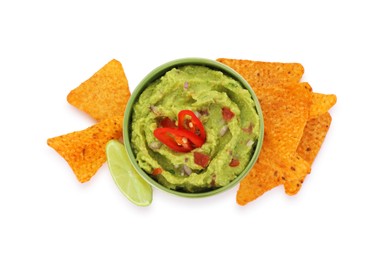 Bowl of delicious guacamole, lime and nachos chips isolated on white, top view