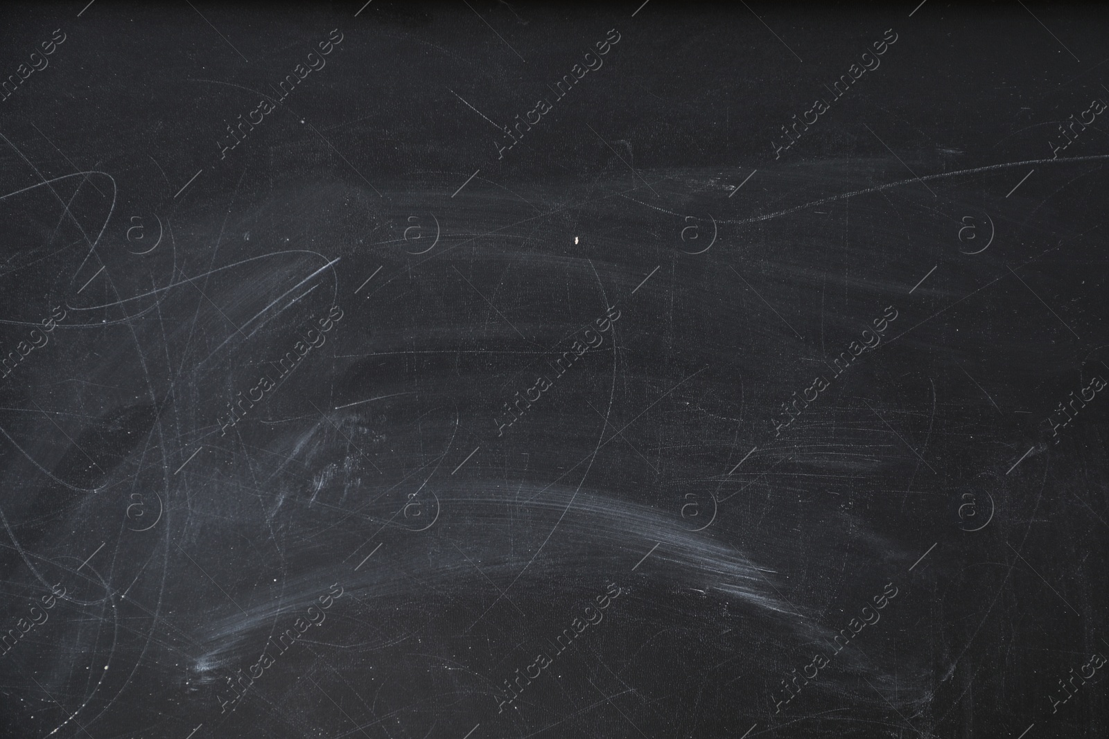 Photo of Chalk rubbed out on blackboard as background, closeup. Space for text