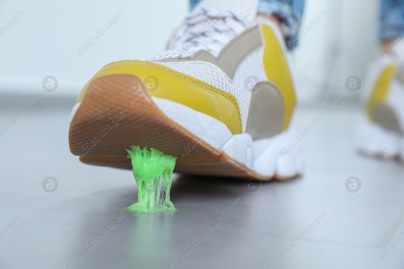 Photo of Person stepping into chewing gum on floor, closeup