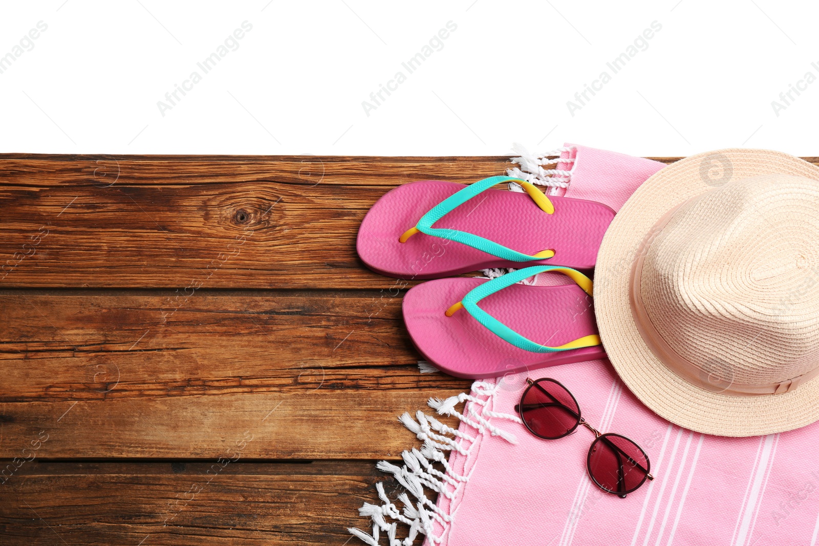 Photo of Beach accessories on wooden table, flat lay. Space for text