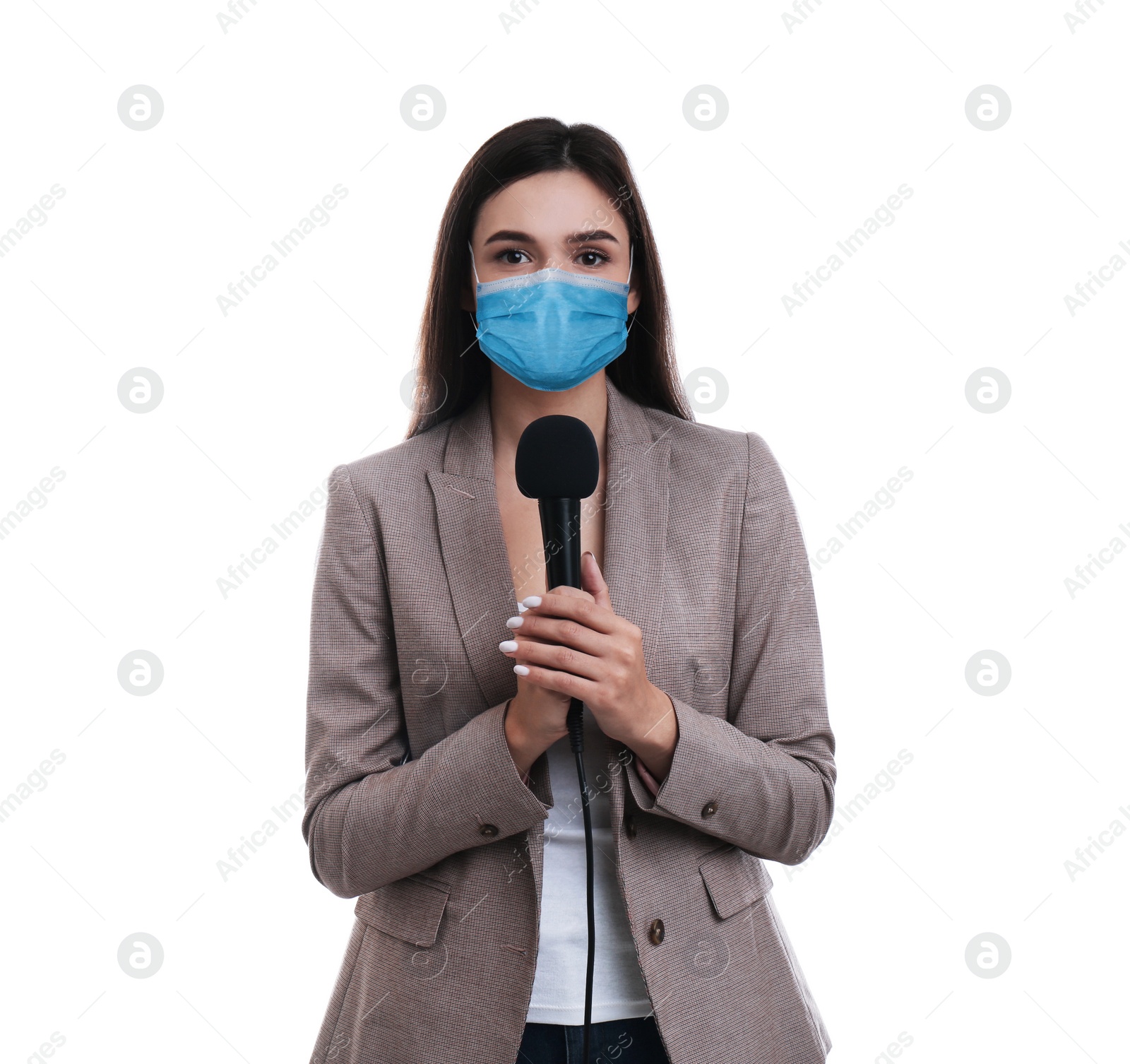 Image of Young journalist with microphone wearing medical mask on white background. Virus protection