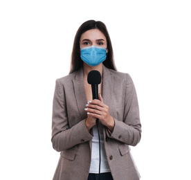 Image of Young journalist with microphone wearing medical mask on white background. Virus protection
