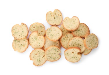 Heap of crispy rusks with seasoning on white background, top view