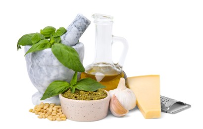 Different ingredients for cooking tasty pesto sauce isolated on white