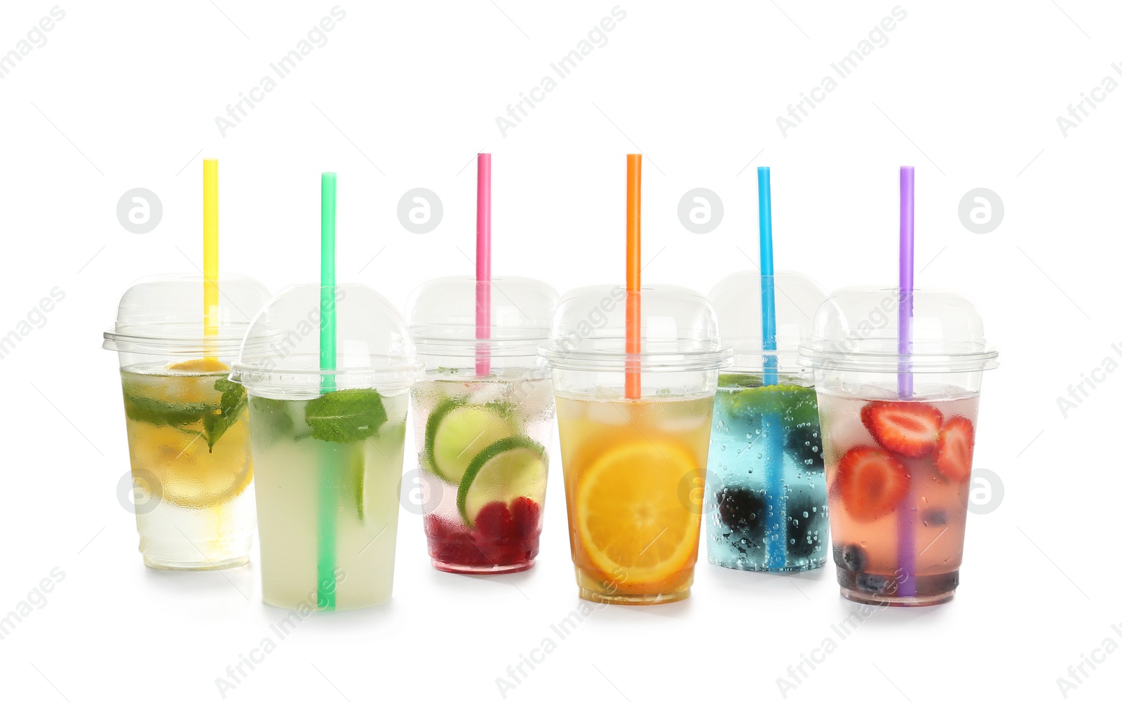 Photo of Plastic cups with lemonades on white background