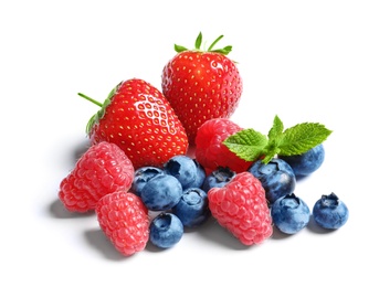 Raspberries, strawberries and blueberries on white background