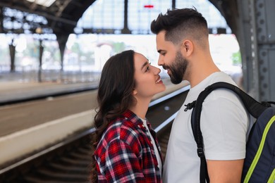 Photo of Long-distance relationship. Beautiful couple on platform of railway station