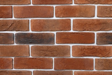 Photo of Decorative bricks on repaired wall as background, closeup