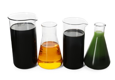 Beakers and flasks with different types of oil isolated on white