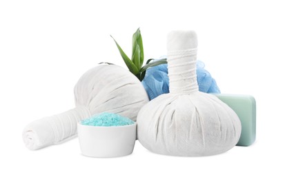 Photo of Herbal massage bags, sea salt and soap on white background. Spa supply